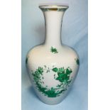 A Herend vase hand painted with green floral decoration, gilt rim and foot, height 27 cm