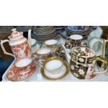 A Royal Crown Derby teapot; a harlequin set of cups and saucers; etc.