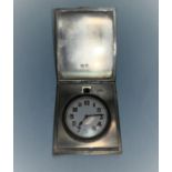 An Art Deco travelling bedside clock in silver case, engine turned decoration, Birmingham 1923, 4.