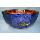 A 1930's Wedgwood octagonal lustre bowl decorated with birds of paradise against blue externally,