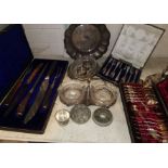 A part carving set by Thomas Turner, boxed; a silver plated teaspoon and tongs set, boxed; other