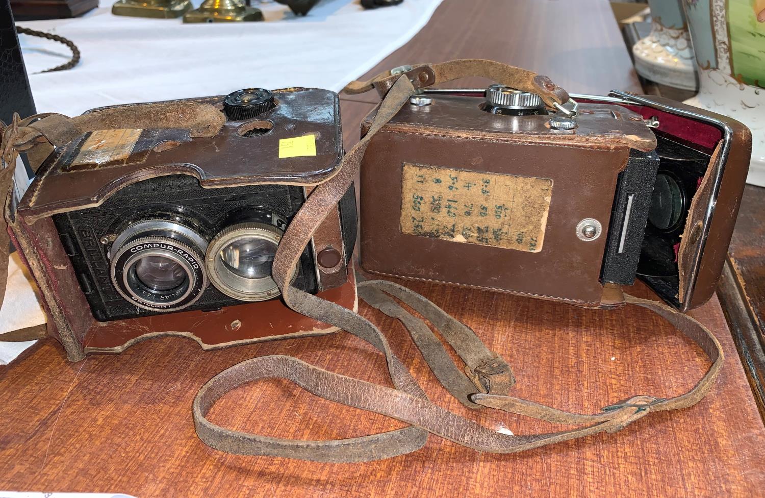 a YASHICA-MAT TLR camera in leather case with accessories and another similar camera