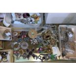 A collection of costume jewellery brooches; etc.