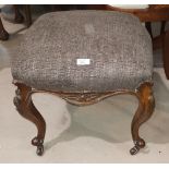 A Victorian walnut stool with square top, on cabriole legs and castors; a similar stool