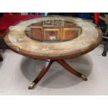 A Regency style inlaid mahogany pedestal coffee table with circular glass top