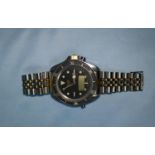 A Heuer Model 1000 dive watch with digital display under hour and date hands, rotating bezel,