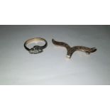 A 9 carat gold brooch; a 9 carat gold dress ring, 4.4gm gross