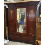 An Edwardian mahogany 2 piece bedroom suite with Art Nouveau inlay, comprising mirror door