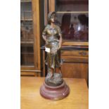 A 19th century patinated bronzed figure "Au Champ", by A de Runieri, on wooden plinth