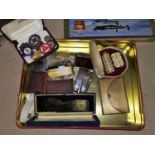 A selection of vintage cigarette lighters; compacts; a selection of badges; etc.
