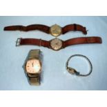 A 9ct gold cased watch and three others