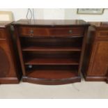 A Regency style inlaid mahogany bookcase with frieze drawers and shelves under