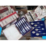 A selection of boxed and loose cutlery; dressing table sets; silver plate; etc.