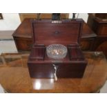 A Georgian mahogany rectangular tea caddy, the interior with 2 compartments and matched cut glass