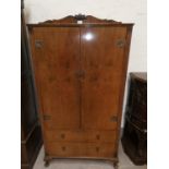 A reproduction walnut tallboy with double cupboard over 2 drawers