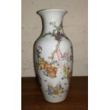 A Chinese porcelain vase with enamelled decoration of genre scenes, 24 cm, seal mark to base (repair
