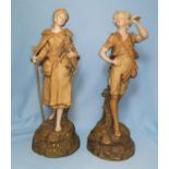 A pair of 19th century Turnwein figures, man with horn and woman carrying a kid, height 34cm (