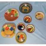 Three small circular Clarice Cliff dishes / ashtrays with geometric decoration , diameter 7cm; 2