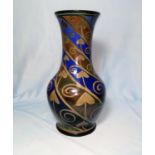 A Royal Lancastrian baluster shaped vase with silvered decoration in spirals on blue ground,