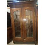 A French Provincial oak full height side cabinet with 2 glazed doors, on shaped feet, height 230