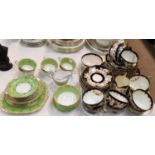 An Edwardian Japan pattern part tea service, 36 pieces; an "Old English" green & gilt part tea