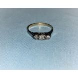 A 3 stone diamond ring, stamped '9 ct'