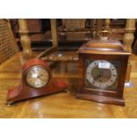 A Georgian style bracket clock in walnut case; an Edwardian mantel clock in inlaid mahogany case