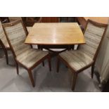 A 1960's golden oak drop leaf dining table with rectangular top; 4 G-Plan dining chairs