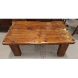 A rustic style rectangular coffee table; a similar smaller table