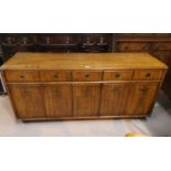 A 1970's hardwood sideboard, "American Military" style by Drexel, the frieze drawers and 4 cupboards