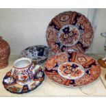 Two 19th century Imari plaques, diameter 33 cm; 2 similar smaller (1 a.f.); a teapot (lid a.f.); a