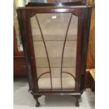 A 1930's small mahogany display cabinet enclosed by single door