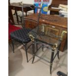 An occasional table and chair in wrought and gilt metal