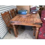 A rustic style hardwood dining suite comprising rectangular table and 6 chairs