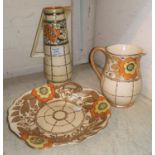 Two Charlotte Rhead tube lined jugs heights 25cm and 16cm and a shallow dish length 25cm
