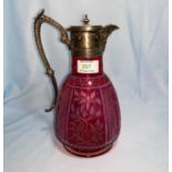 A Victorian claret jug, cut and overlaid cranberry glass with EPNS mount, 26 cm