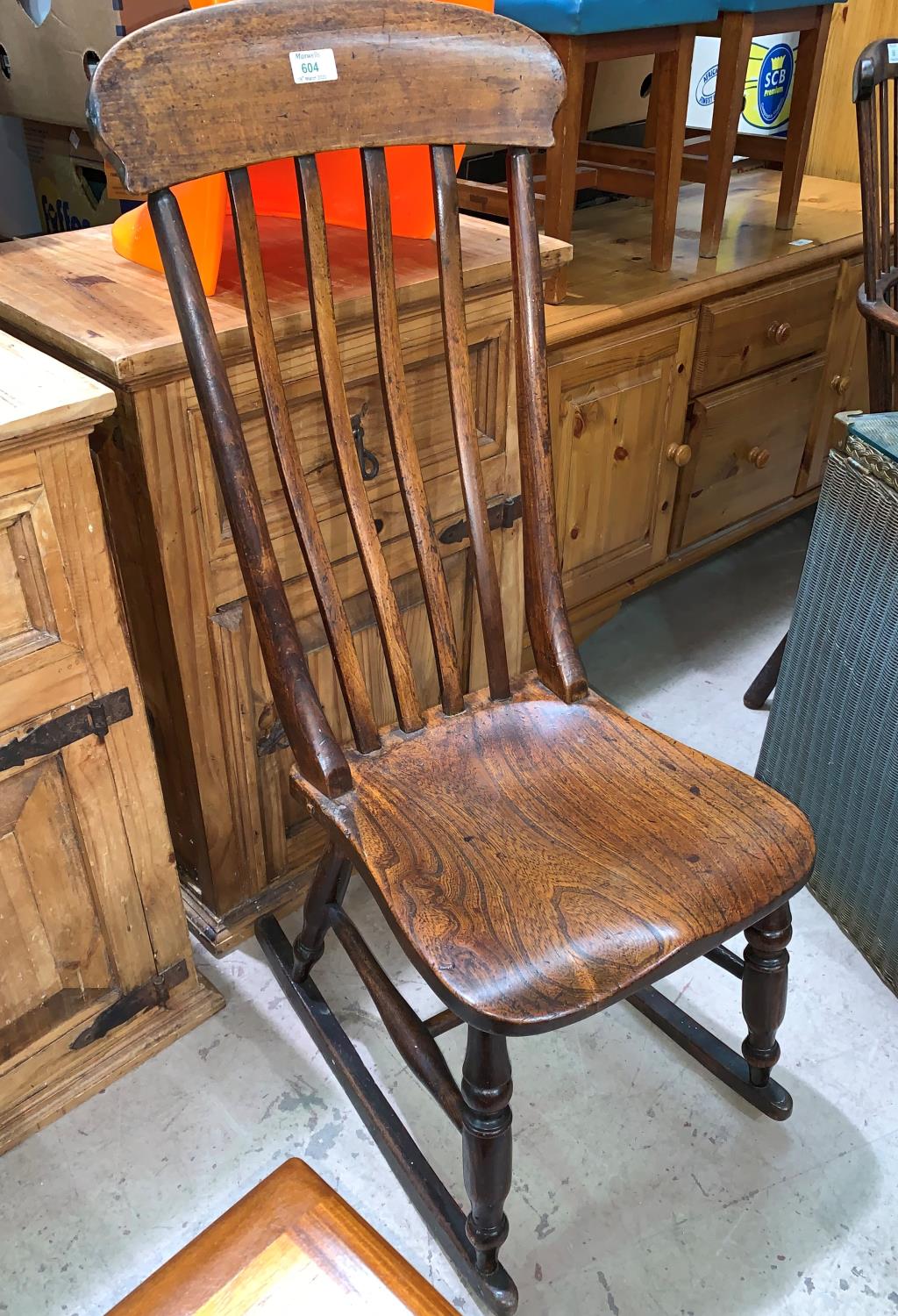A 19th century country made rocking nursing chair in elm and beech