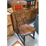 A 19th century country made rocking nursing chair in elm and beech