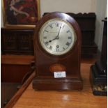 A 1920's mantel clock in mahogany arched case with 8 day movement, Thomas Russell and Son