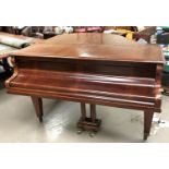 A baby grand piano, overstrung and iron framed, in mahogany case, by Schimmel, with stool