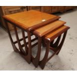 A 1930'S G-Plan nest of 3 teak coffee tables; a walnut nest of 3 occasional tables