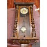 A Victorian Vienna wall clock in walnut case, with striking spring driven movement