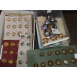 A collection of buttons: military; naval; military police; fire brigade; various German examples