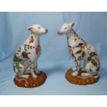 A pair of Chinese porcelain dog figures, red seal marks to base, 23 cm
