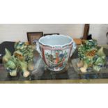 A Chinese double handled ceramic bowl with polychrome decoration of flowers etc with wavy rim ht 21