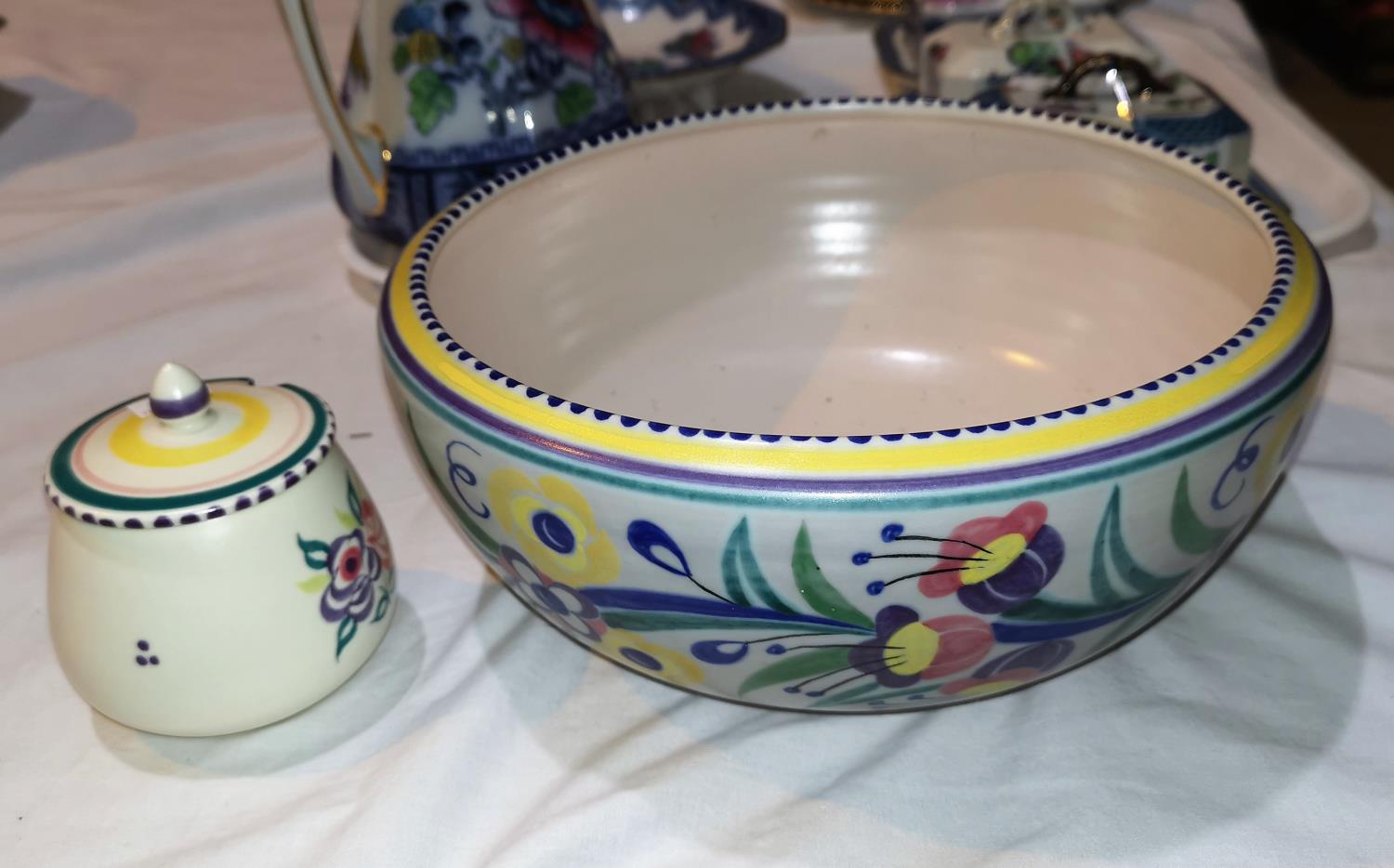 A 1950's Poole fruit bowl, diameter 25cm, and a preserve pot