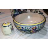 A 1950's Poole fruit bowl, diameter 25cm, and a preserve pot