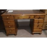 A Ducal pine twin pedestal desk inset tooled leather writing surface, 120 x 62 cm
