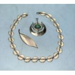 A Norwegian silver pendant set pale blue stone; a similar enamelled leaf link necklace and