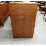 A 1960's gents teak 5 height dressing chest with hinged top dressing mirror